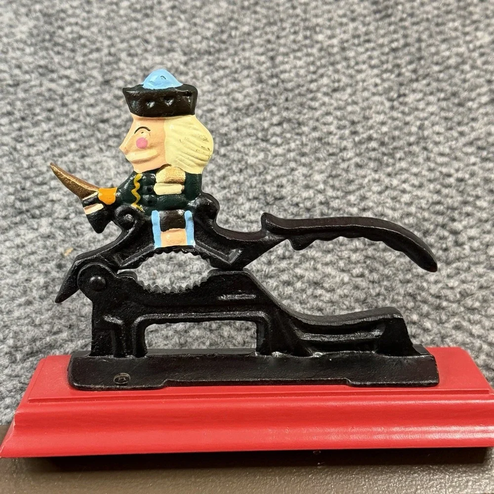Vintage Cast Iron Soldier Nutcracker Mounted On Red Wooden Base Nut Cracker